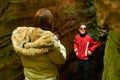 Hispanic couple taking pictures in Mullerhal national park in Luxembourg