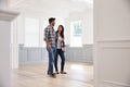 Hispanic Couple Viewing Potential New Home