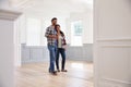 Hispanic Couple Viewing Potential New Home