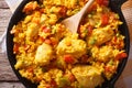 Hispanic cuisine: Arroz con pollo closeup in a pan. horizontal top view Royalty Free Stock Photo