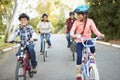 Hispanic Family On Cycle Ride In Countryside Royalty Free Stock Photo