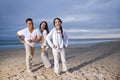 Hispanic family with daughter having fun on beach Royalty Free Stock Photo