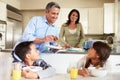 Hispanic Family Eating Breakfast At Home Together Royalty Free Stock Photo