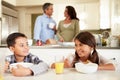 Hispanic Family Eating Breakfast At Home Together Royalty Free Stock Photo