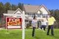 Hispanic Family in Front of Sold Real Estate Sign, House Royalty Free Stock Photo