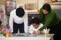 Hispanic Family in Home-school Setting Studying Rocks Royalty Free Stock Photo