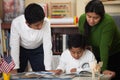 Hispanic Family in Home-school Setting Studying Rocks Royalty Free Stock Photo