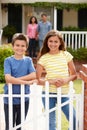 Hispanic family standing outside home Royalty Free Stock Photo