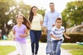 Hispanic Family Walking In Park Together Royalty Free Stock Photo