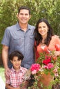 Hispanic Family Working In Garden Tidying Pots Royalty Free Stock Photo