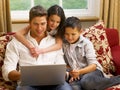 Hispanic father and children shopping online