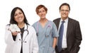 Hispanic Female Doctor or Nurse with Baby Shoes and Stafff Royalty Free Stock Photo