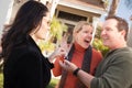 Hispanic Female Real Estate Agent Handing Keys to