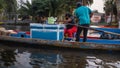 Hispanic food vendors in thin boat in Xochimilco lake