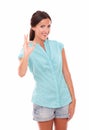 Hispanic girl in blue blouse gesturing a great job Royalty Free Stock Photo