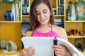 Hispanic girl reading at home Royalty Free Stock Photo