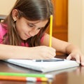 Hispanic girl working on her art project Royalty Free Stock Photo