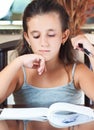 Hispanic girl working on her homework Royalty Free Stock Photo