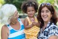 Hispanic grandma, mother and small daughter