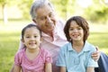 Hispanic Grandmother And Grandfather Relaxing With Grandson In P