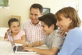 Hispanic Grandparents And Grandchildren Using Computer At Home Royalty Free Stock Photo