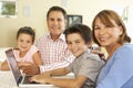 Hispanic Grandparents And Grandchildren Using Computer At Home Royalty Free Stock Photo