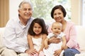 Hispanic grandparents at home with grandchildren Royalty Free Stock Photo