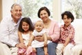 Hispanic grandparents at home with grandchildren Royalty Free Stock Photo