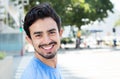 Hispanic guy in the city looking at camera Royalty Free Stock Photo