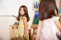 Hispanic little girl enjoying art class