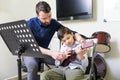 Caucasian Boy Taking Ukulele Classes From Mid Adult Teacher Royalty Free Stock Photo