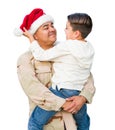 Hispanic Male Soldier Wearing Santa Cap Holding Mixed Race Son Isolated on a White Background Royalty Free Stock Photo