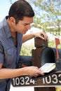 Hispanic Man Checking Mailbox Royalty Free Stock Photo