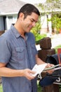 Hispanic Man Checking Mailbox Royalty Free Stock Photo