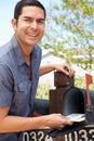 Hispanic Man Checking Mailbox Royalty Free Stock Photo