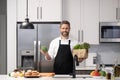 Hispanic man cooking in kitchen. Healthy food for dinner. Man cooking home food. Healthy food, cooking concept. Mature Royalty Free Stock Photo