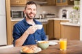 Hispanic man eating breafast at home Royalty Free Stock Photo