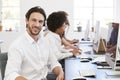 Hispanic man with headset on smiling to camera in an office Royalty Free Stock Photo