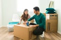 Hispanic man and his girlfriend moving out of an apartment Royalty Free Stock Photo
