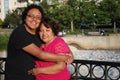 Hispanic man and his mother smiling outdoors Royalty Free Stock Photo