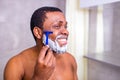 hispanic man put on foam on beard perfume lotion or skin care cream for sensitive skin