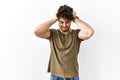 Hispanic man standing over isolated white background suffering from headache desperate and stressed because pain and migraine Royalty Free Stock Photo