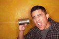 Hispanic man with tin can telephone Royalty Free Stock Photo