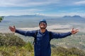 Hispanic man at the top of a mountain with open arms Royalty Free Stock Photo