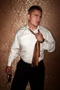 Hispanic man tugging on his tie Royalty Free Stock Photo