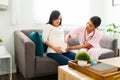 Pretty female nurse checking the belly of an expectant mother Royalty Free Stock Photo
