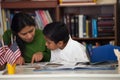 Hispanic Mom and Boy in Home-school Environment Studying Rocks Royalty Free Stock Photo