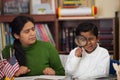 Hispanic Mom and Boy in Home-school Environment Studying Rocks Royalty Free Stock Photo