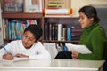 Hispanic Mom and Boy in Home-school Setting Royalty Free Stock Photo