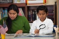 Hispanic Mom and Boy in Home-school Setting Royalty Free Stock Photo